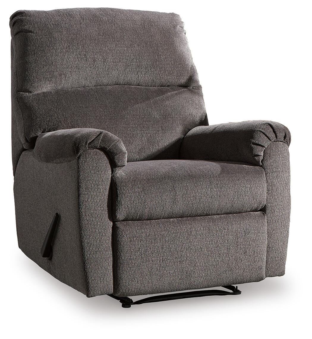 Ashley Nerviano manual recliner in brown leather, shown from an angle with closed reclining mechanism and cushioned armrests.