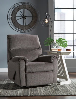 Ashley Nerviano manual recliner in brown leather with plush cushioning and wooden armrests, designed for comfort and style.