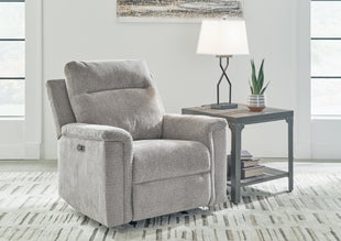 Ashley Barnsana Power Recliner in charcoal fabric, showing cushioned armrests and reclining feature with built-in controller.