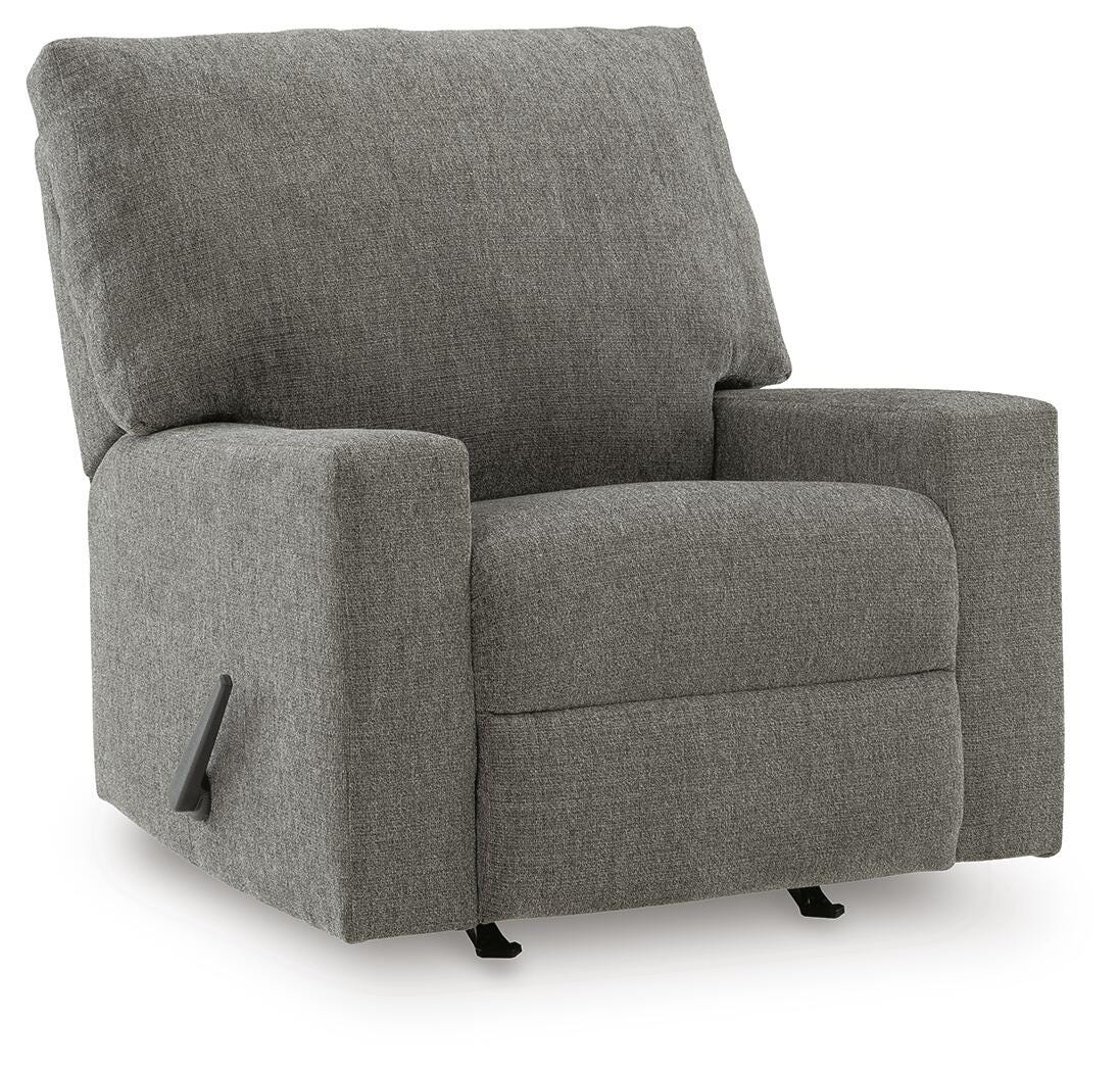 Ashley Newellen manual recliner in dark brown leather with plush cushioning and a classic design, viewed from an angle.