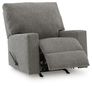 Ashley Newellen manual recliner shown in a partially open position, featuring plush upholstery and a wooden base.