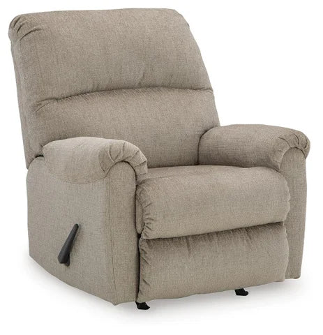 Ashley Stonemeade manual rocker recliner with plush cushioning and a classic design, shown from an angle in a closed position.