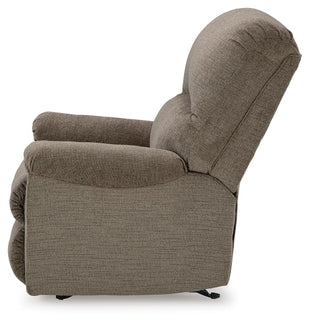 Ashley Stonemeade manual rocker recliner showing plush fabric, padded armrests, and reclining mechanism from a side view.