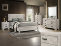 White bedroom furniture set from Crownmark's Millie Bedroom Group featuring a bed, dresser, and nightstand.