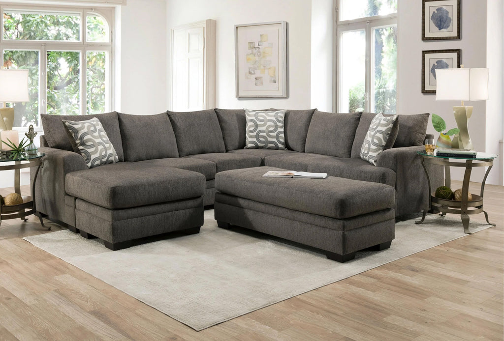 Ashley Charcoal U-shaped sectional sofa with plush cushions and modern design, shown in a living room setting.