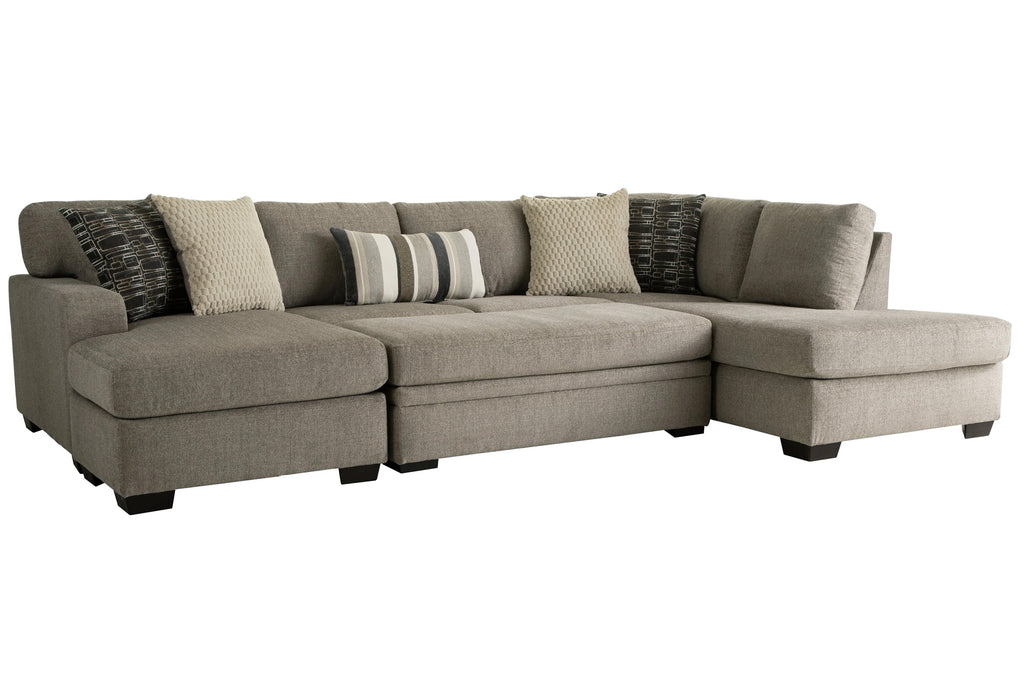 Brown U-shaped sectional sofa by Behold, featuring plush cushions and a modern design, shown in a cozy living room setting.