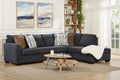 Dark blue Behold L-shaped sectional sofa with plush cushions and modern design, shown from a side angle in a living room setting.