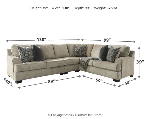 Brown Ashley L-shaped sectional sofa with plush cushions, shown in a modern studio setting.