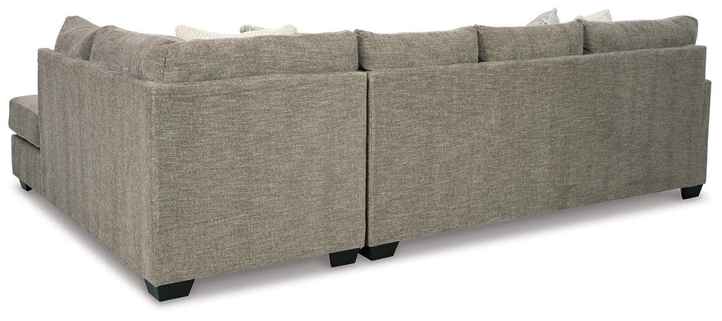 Beige Ashley U-shaped sectional sofa with plush cushions and modern design, shown in a stylish living room setting.