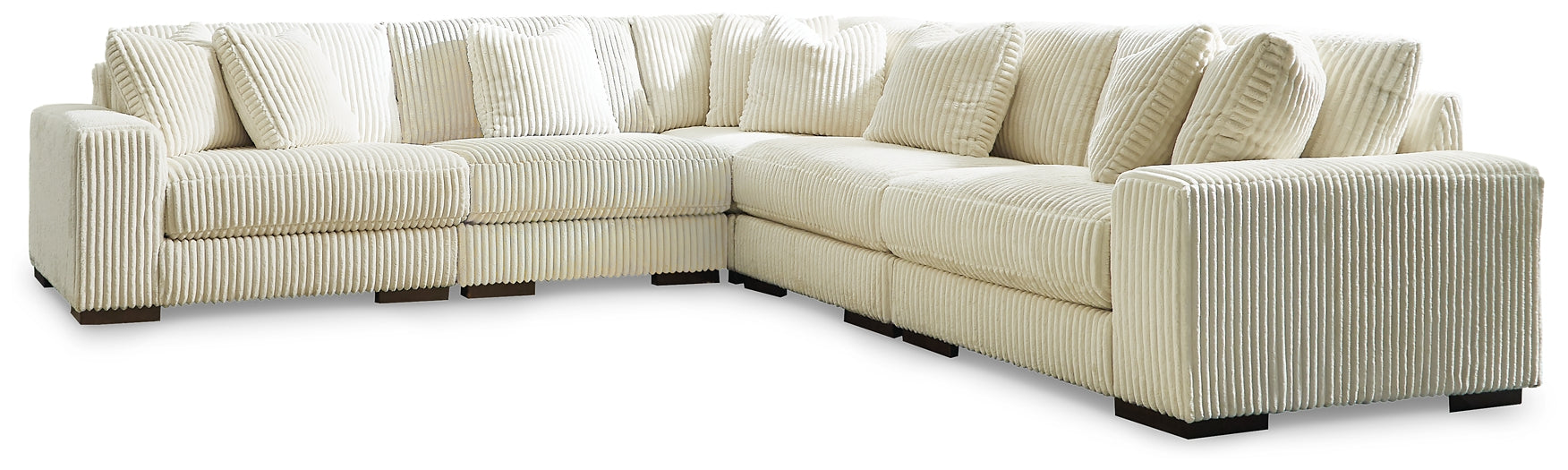 Ivory corduroy L-shaped sectional sofa by Ashley with plush cushions and modern design in a stylish living room setting.