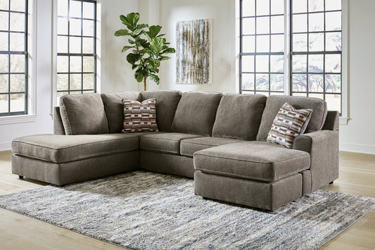 Brown Ashley U-shaped sectional sofa with plush cushions and modern design, shown in a stylish living room setting.