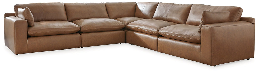 Genuine leather sectional sofa with five pieces, featuring plush cushions and a modern design in a neutral tone.