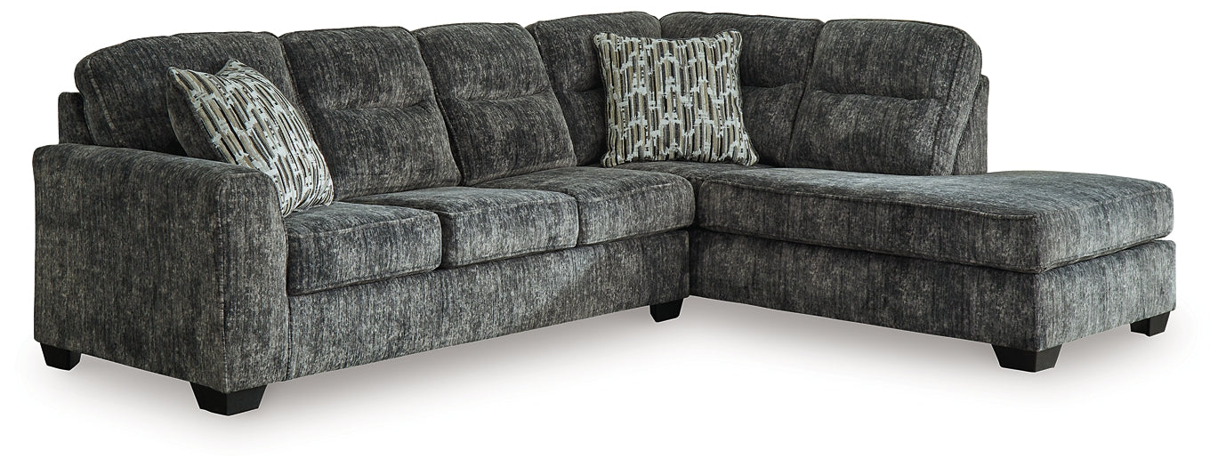 Grey Ashley L-shaped sectional sofa in a modern living room setup with plush cushions and sleek design.
