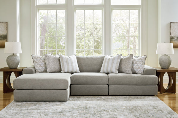 Grey Ashley sofa chaise with plush cushions and modern design, shown from a studio setting highlighting its stylish comfort.