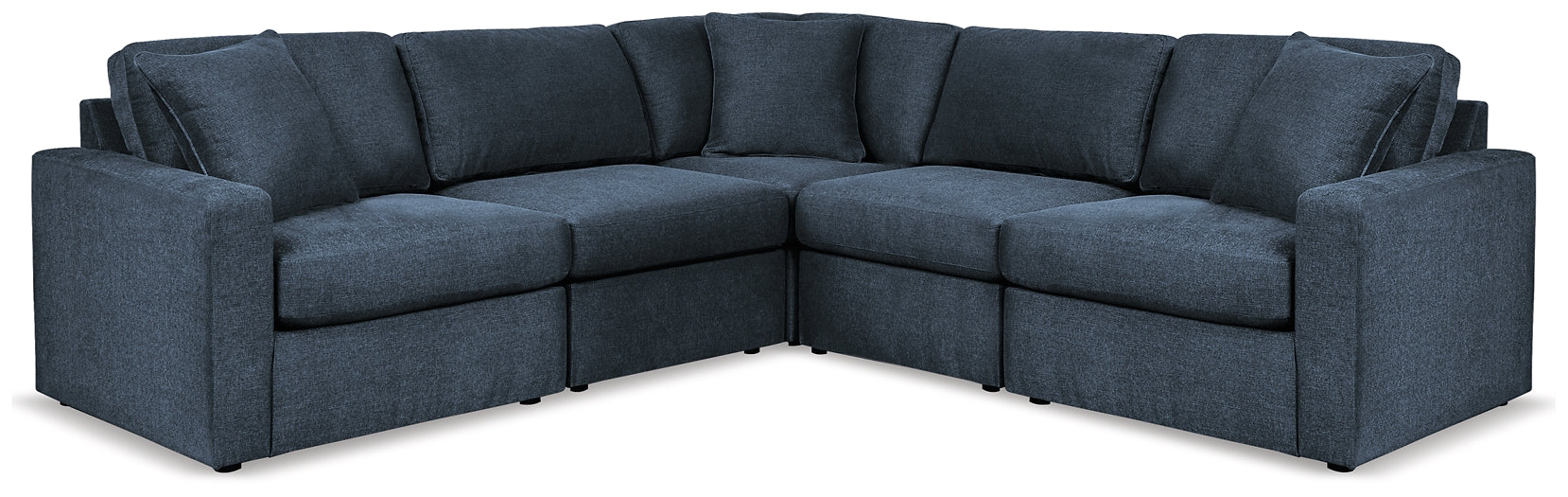 Blue Ashley modular L-shaped sectional sofa in a modern studio setting with plush cushions and sleek design.