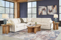 Cream Ashley modular L-shaped sectional sofa in a modern studio setting with plush cushions and sleek design.