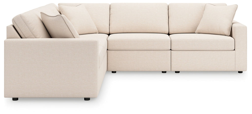Cream Ashley modular L-shaped sectional sofa with plush cushions and modern design, shown in a stylish studio setting.