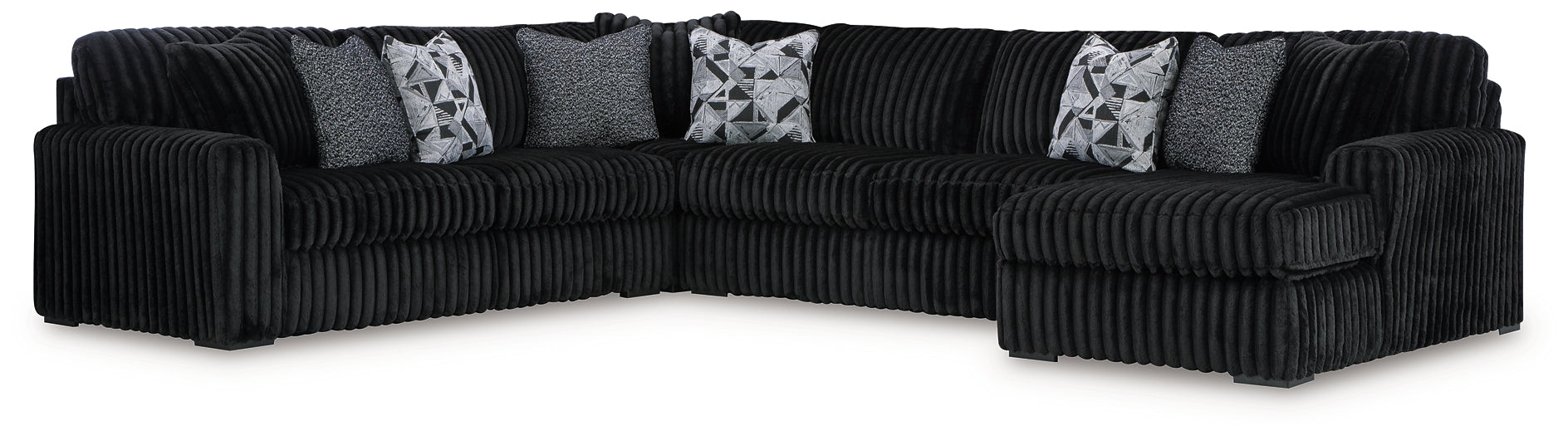 Black corduroy U-shaped sectional sofa by Ashley, featuring plush cushions and a modern sectional design, photographed in a studio setting.