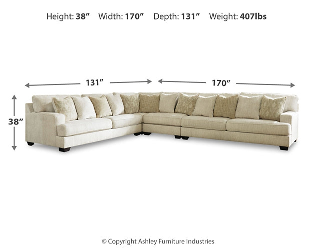 Ivory Ashley L-shaped sectional sofa in a modern living room setting with plush cushions and sleek design.