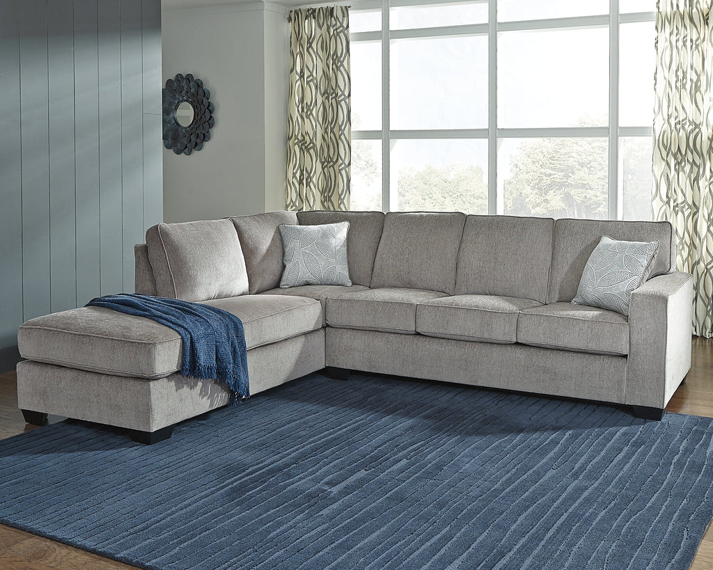 Grey Ashley L-shaped sleeper sectional sofa in a modern living room with plush cushions and clean lines.