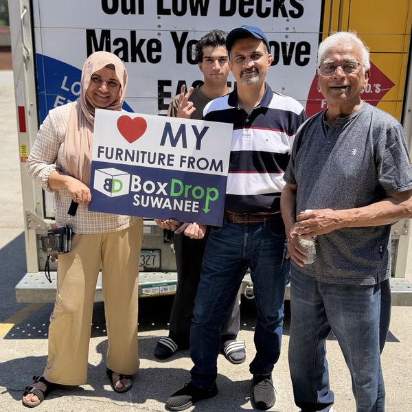 A family outside BoxDrop Suwanee after picking up their furniture