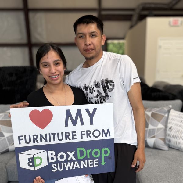 A couple with their new sectional at BoxDrop Suwanee