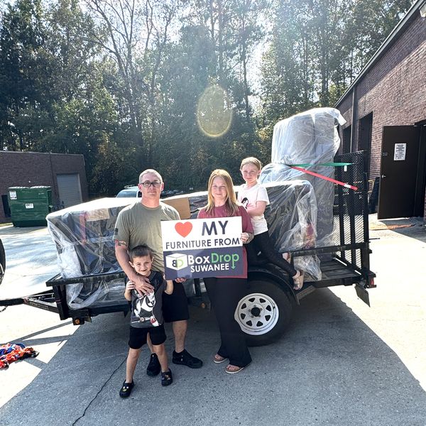 A family loading their new furniture to take home the same day